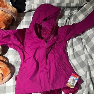 Warm north face jacket with tag. Unused.